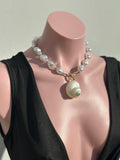 Collar concha cyprea y perlas
