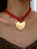 Collar corazon dorado con  cordon rojo