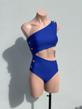 Gold buttons cut out blue one piece