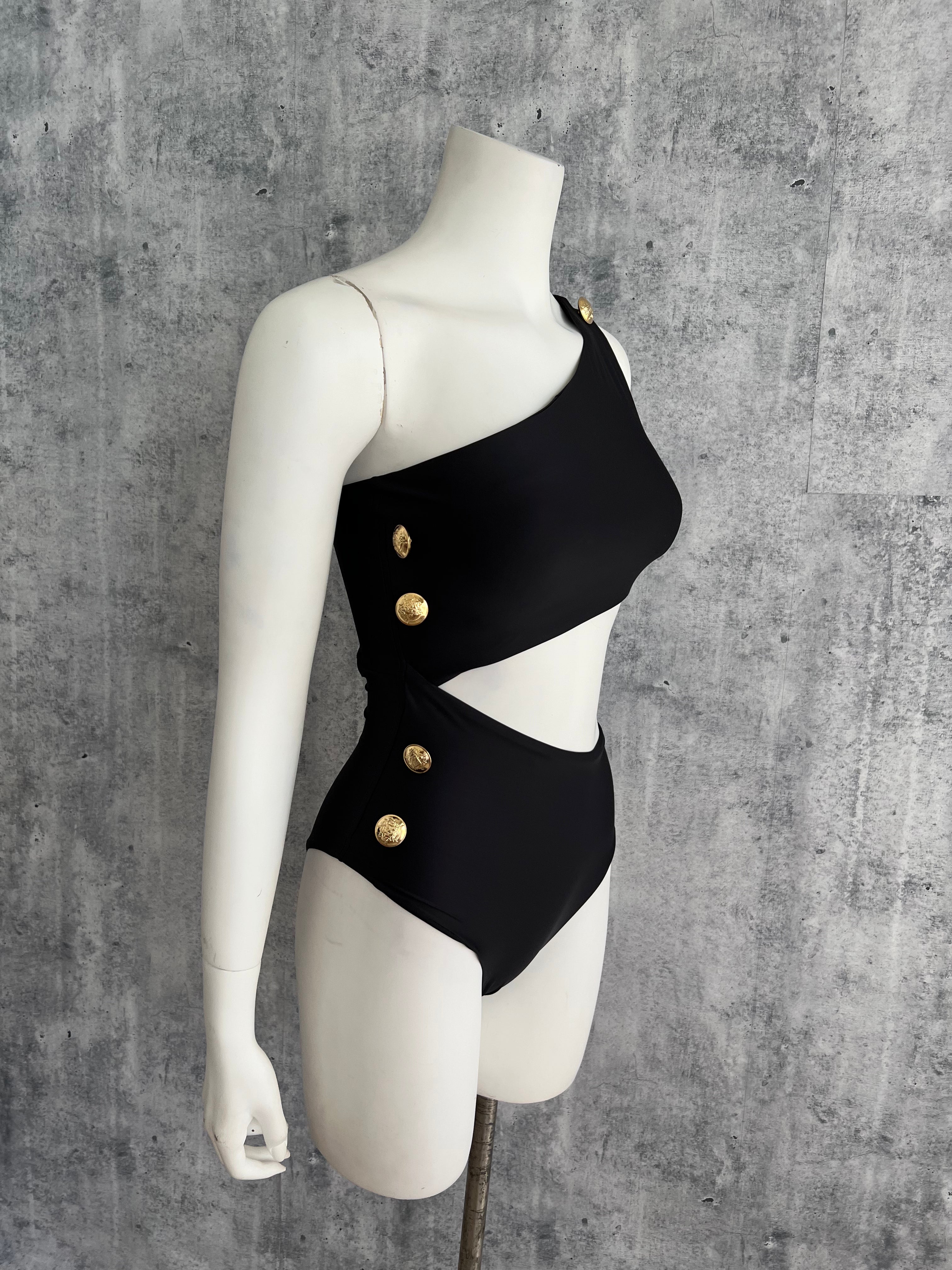 Gold buttons cut out black one piece